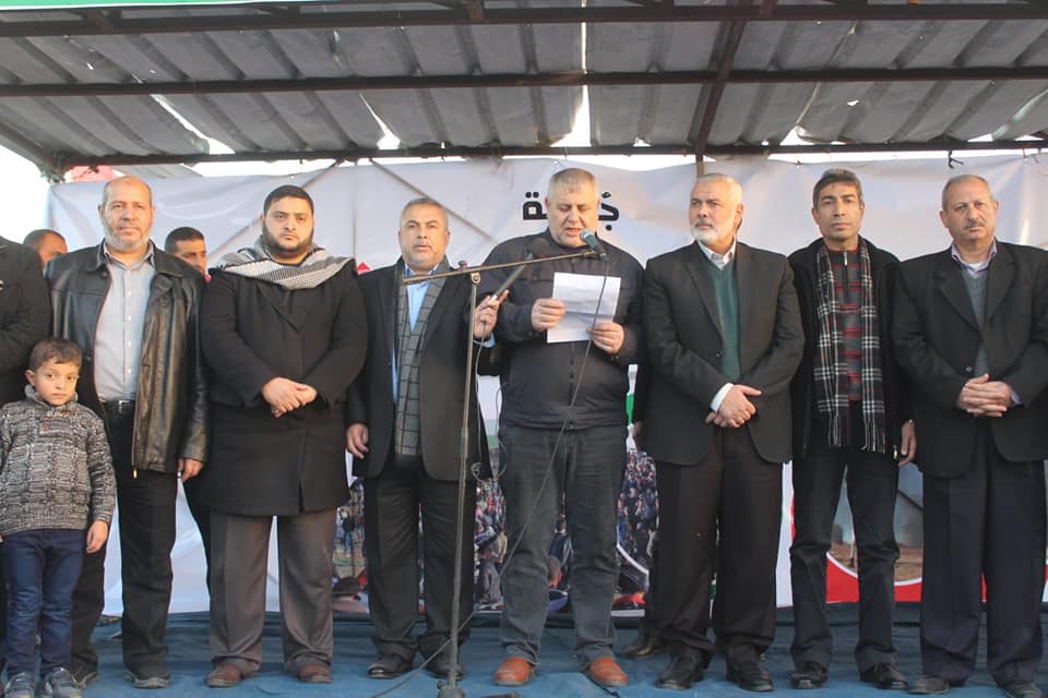 Isma'il Haniyeh (third from right) and Khalil al-Haya (extreme left) at the 