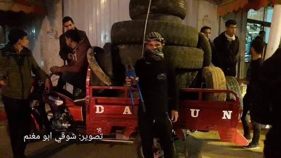 ight harassment unit operatives collect tires for burning (night harassment unit Facebook page, February 13, 2019).