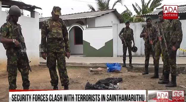 Sri Lankan soldiers standing near the explosive materials found in one of the houses (YouTube channel of ADA derana, April 27, 2019). 