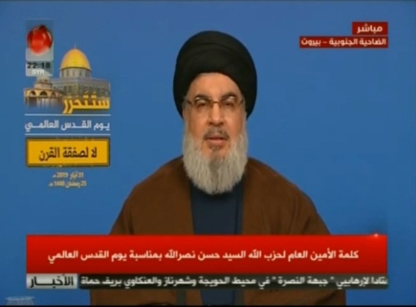 Hezbollah leader Hassan Nasrallah gives a speech at the main event. In the upper left-hand corner is a picture of the Dome of the Rock, with the inscription "[Jerusalem] will be liberated, Jerusalem Day, No to the "deal of the century" (YouTube).