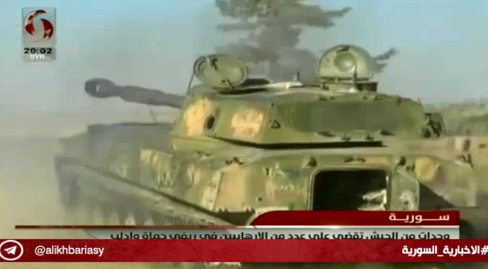 Syrian army self-propelled gun fires at forces of the Headquarters for the Liberation