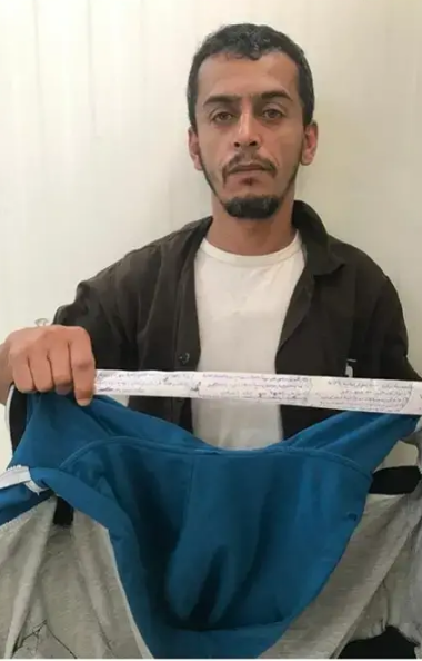 Fadi Abu al-Subah, who was recruited to Hamas' military wing and entered Israel by exploiting a permit to receive medical treatment. He is holding a strip of material with code words, which was hidden inside his jacket (Israel Security Agency, July 3, 2019).