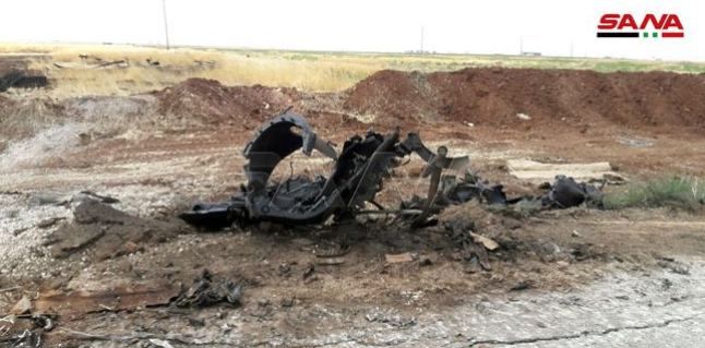 Wreckage of an APC of the Headquarters for the Liberation of Al-Sham which was destroyed by the Syrian army on the road leading to the village of Al-Qasabiya (SANA, July 21, 2019)