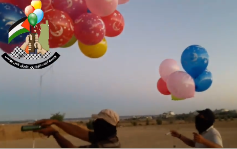 The Sons of al-Zawari unit in eastern Khan Yunis prepares incendiary balloons for launching into Israeli territory. 