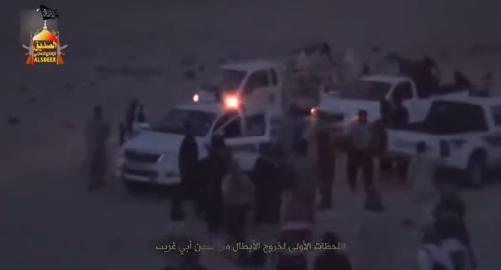 Photo from a video showing ISIS vehicles waiting for the evacuation of the escaping prisoners outside Abu Ghraib Prison. 