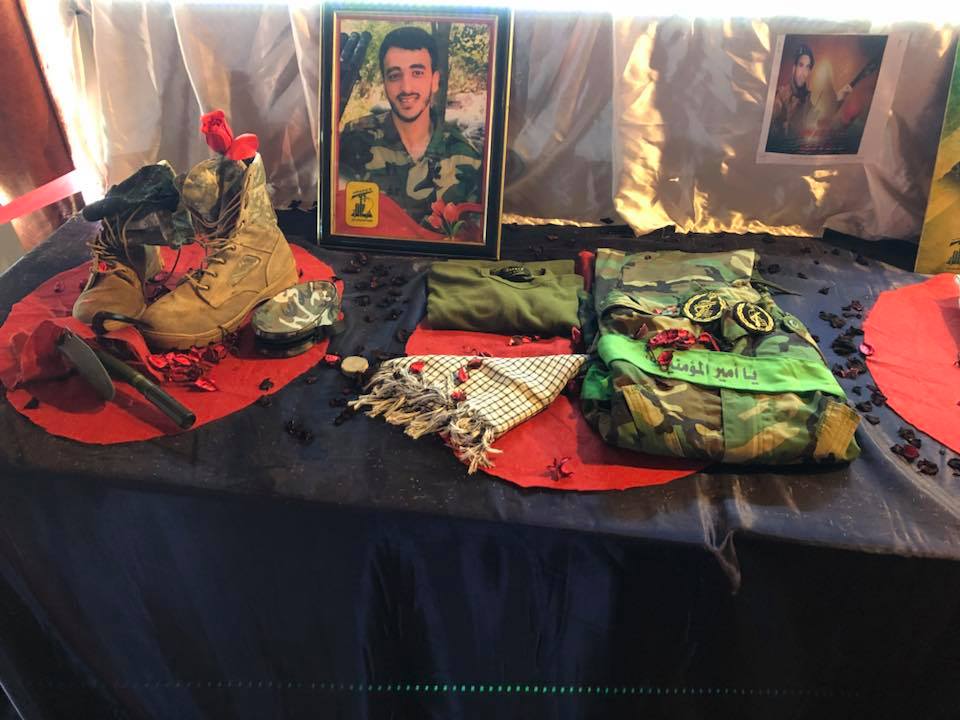 Belongings of Hezbollah’s shahids at an exhibition in memory of shahids at the detention facility in Al-Khiyam. On the uniforms, there are unit badges of the Iranian Revolutionary Guards (Facebook)