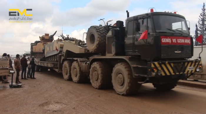 Turkish army truck carrying two APCs near the village of Hazanu (north of Idlib) on their way to the Idlib rural area.