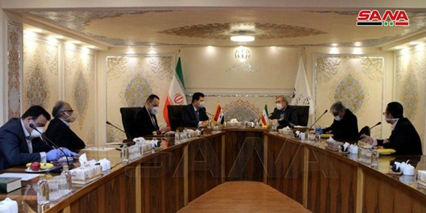 The meeting between the Syrian ambassador to Tehran and the chairman of the Iranian Supreme Council on Free Trade Zones (SANA, April 14, 2020)