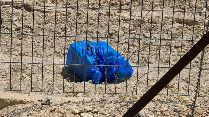 Dummy IED claimed placed at a site where the fence was damaged. 