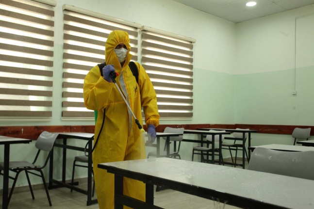 Disinfecting schools in Hebron in preparation for holding matriculation exams (Wafa, May 27, 2020). 