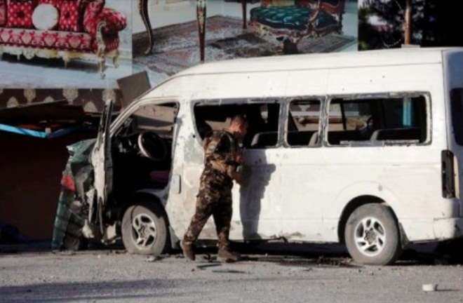 Afghan security guard near the bus against which the IED was activated (Afghanistan Times, May 30, 2020) 