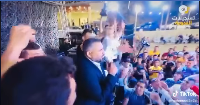 Photo from the wedding video posted by Jenin District Governor Akram al-Rajoub on his Facebook page addressing the wedding singer: “Hafez! When you break the law, the PA arrests you […] Yesterday we made do with detaining you for eight hours, and were it not for our love and respect for [you] Musa Al-Hafez, we would prosecute you” (Akram al-Rajoub’s personal Facebook page, July 3, 2020)