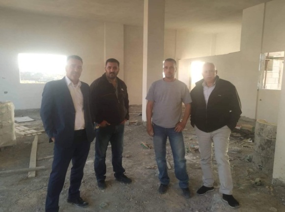 Abd al-Satar Awad (right), the secretary of the Fatah branch in Salfit, visits the house under construction in the village of al-Zawiya for the family of terrorist Omar Abu Layla (Facebook page of the branch of Fatah in al-Zawiya, July 7, 2020). 