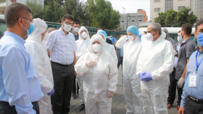 The delegation's visit to the Shifaa Hospital and the central laboratory. Third from the left is deputy minister of health in Gaza, Dr. Yusuf Abu al-Rish (Facebook page of the ministry of health in Ramallah, September 6, 2020).