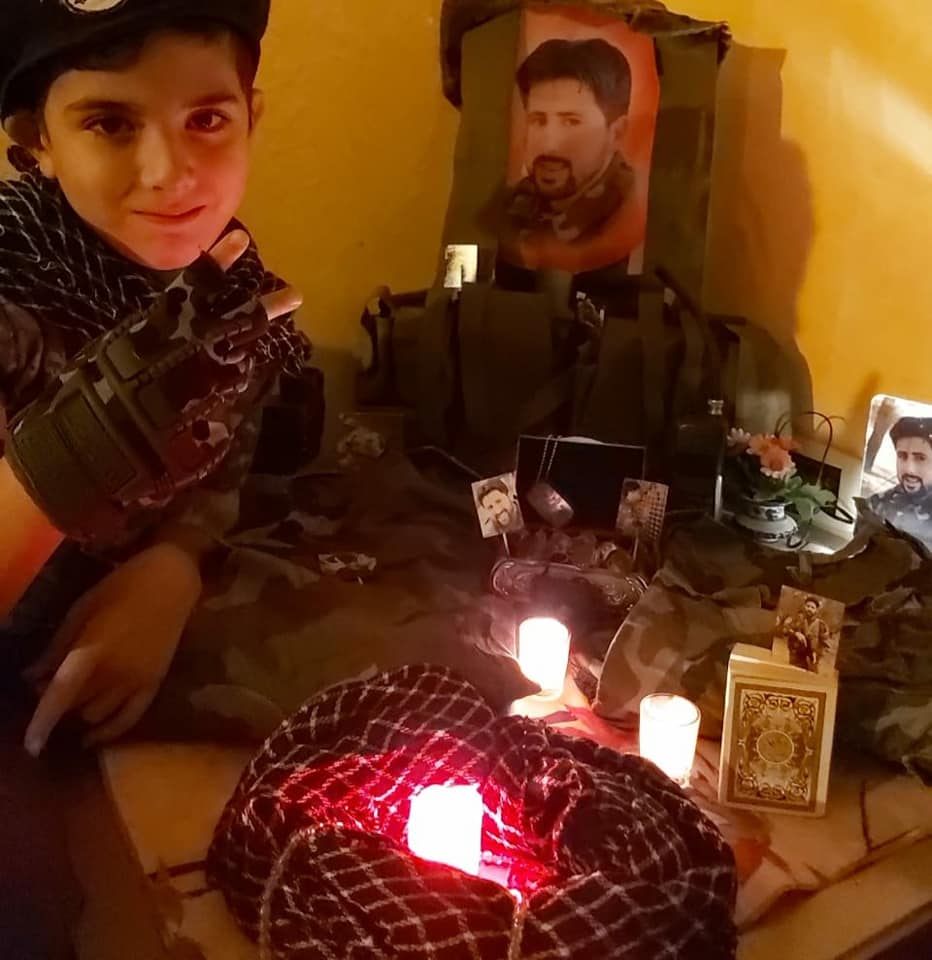 Propaganda activity at the school: the son of Hezbollah shaheed Jamil Hussein Faqih displaying objects related to his father as part of the Shaheed Day 2020 activity at the Al-Mahdi School in Bint Jbeil (Facebook page of the Al-Mahdi School in Bint Jbeil, November 11, 2020).