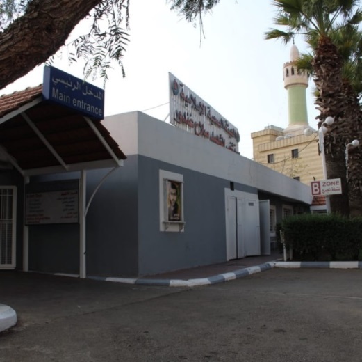 The entrance to Martyr Salah Ghandour Hospital in Beit Jabil. Below the Islamic Health Organization logo, there is a picture of the shaheed Salah Ghandour, who was killed in a car bomb blast in the Bint Jbeil area (Facebook page of the Martyr Salah Ghandour Hospital, November 27, 2019).