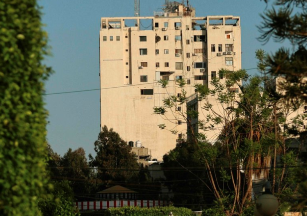 The Al-Shurouq Building in Gaza City before (Twitter account of journalist Hassan Aslih, May 13, 2021) and after the IDF attack (Twitter account of photojournalist Ashraf Abu Amra, May 1