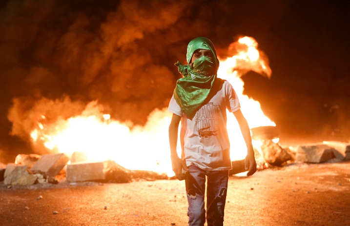 Palestinians riot against Israeli security forces at the northern entrance to Ramallah on May 12, 2021 (Wafa, May 13, 2021)