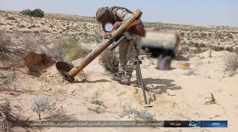 ISIS operative preparing to fire one of the mortar shells.