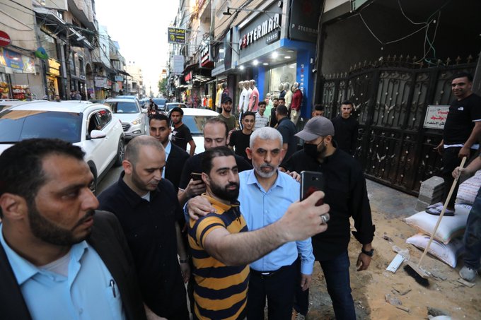 Yahya al-Sinwar walks to his house in Khan Yunis, demolished during the hostilities, after holding a press conference (Palinfo Twitter account, May 26, 2021).