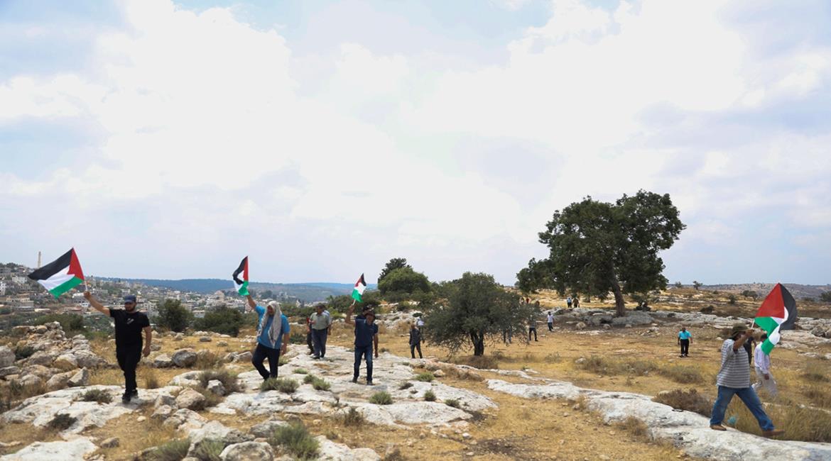 תושבי הכפר נעלין מפגינים נגד הפקעת אדמות (ופא, 23 ביולי 2021)

