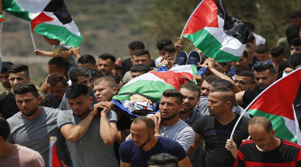 The funeral held in the village of Dir Nidham for Muhammad al-Tamimi (Wafa, July 24, 2021).