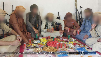 ISIS operatives in Iraq eating the Eid al-Adha meal.