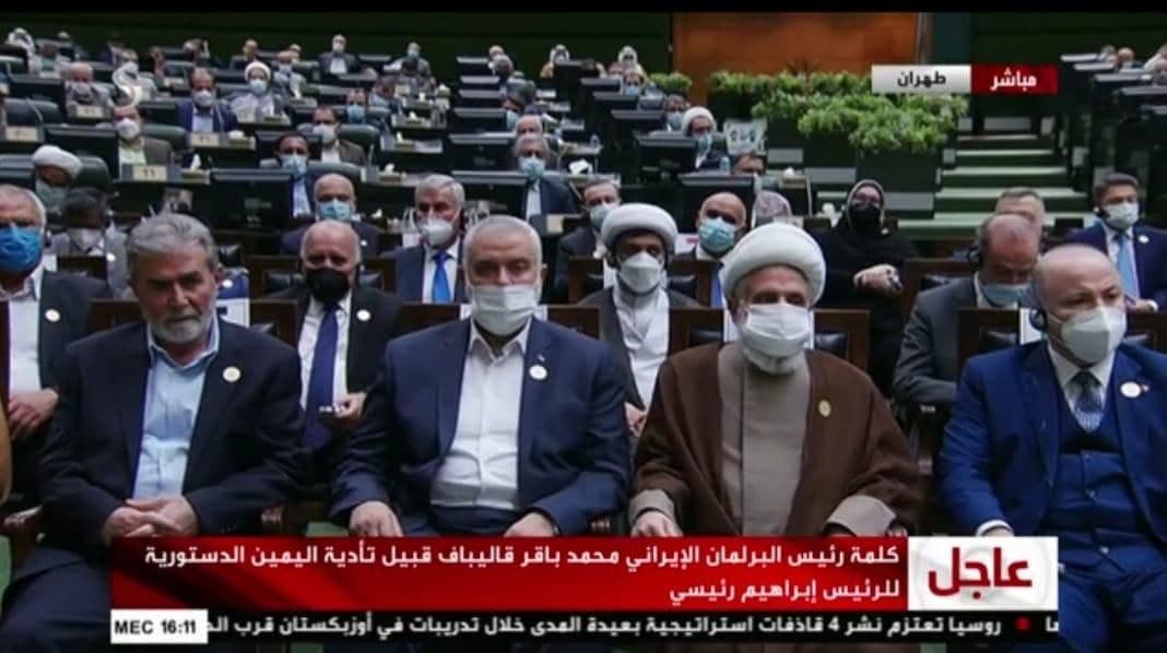 Isma'il Haniyeh, Ziyad al-Nakhalah and Na'im Qassem, deputy head of Hezbollah, sit in the front row during the inauguration of Iranian President Raisi (Shehab Twitter account, August 5, 2021).