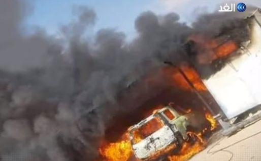 Vehicles going up in flames following the detonation of a car bomb. 