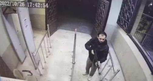 Shooter at the entrance to the Shah Cheragh shrine.