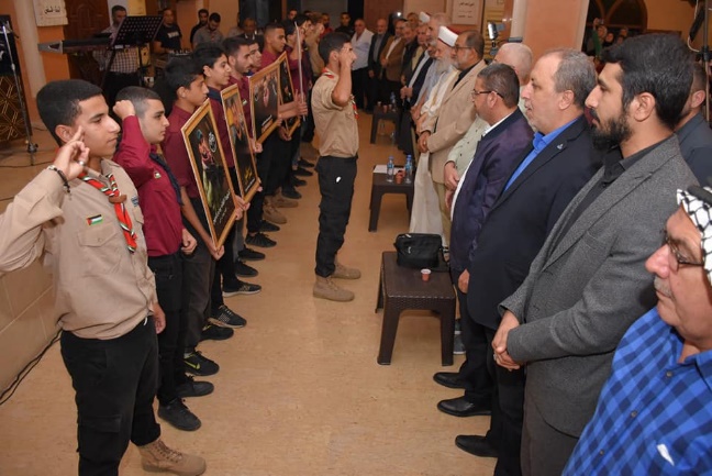 Lebanese Scouts holding pictures of shaheeds (Facebook page of the al-Israa Scouts, November 11, 2022)