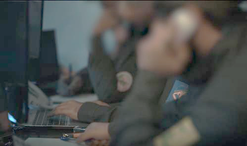 Inside the joint operations room: operatives with Hamas, the Fatemiyoun Brigades and Hezbollah patches on their sleeves (Telegram, April 13, 2023).