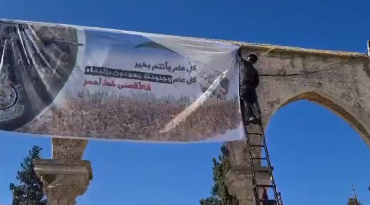 A policeman removes the sign. 