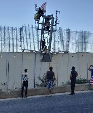 Lebanese cover Israel's border-monitoring cameras near Metulla (LBCI, July 5, 2023; @alishoeib1970 Twitter account, July 12, 2023).