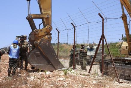 Lebanese army soldiers and a UNIFIL representative near the IDF bulldozer (@alishoeib1970 Twitter account, July 5, 2023)