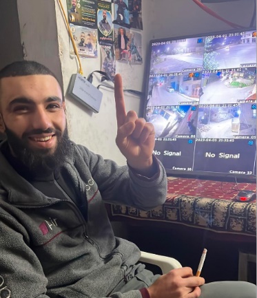 Abu Bakr in one of the situation rooms in the Jenin refugee camp. Pictures of shaheeds are pinned on the wall (Ultra Palestine website, August 5, 2023).