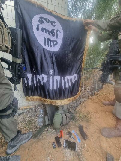 An ISIS flag found in Kibbutz Sufa among the equipment of Hamas terrorists (IDF spokesman, October 12, 2023)