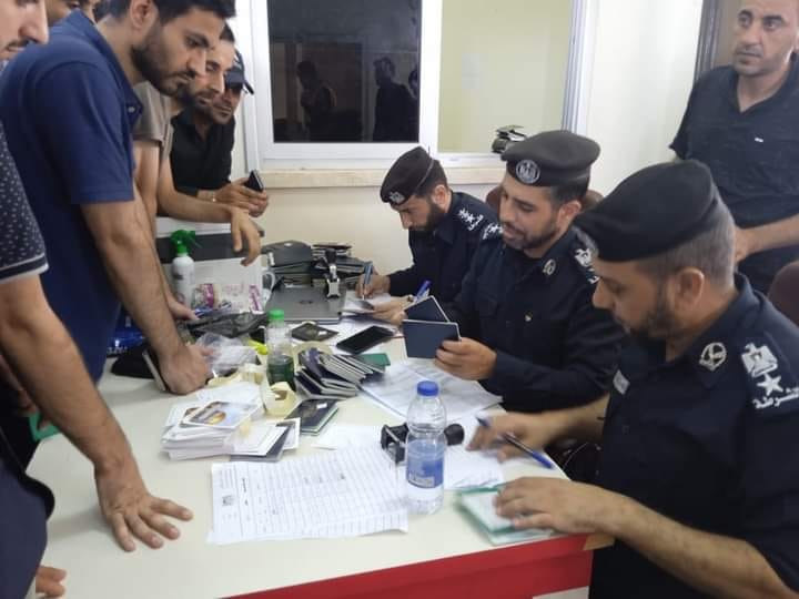 Hamas police officers at the Rafah crossing register people with foreign citizenships before they leave Gaza (Rafah Crossing News Facebook page, November 2, 2023)