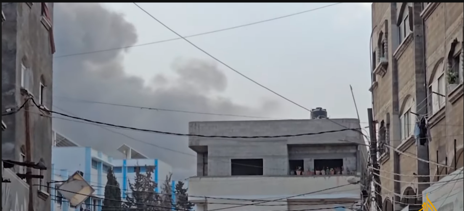 Smoke rises in the Jebalya refugee camp following the IDF attacks (al-Jazeera YouTube channel, May 12, 2024)