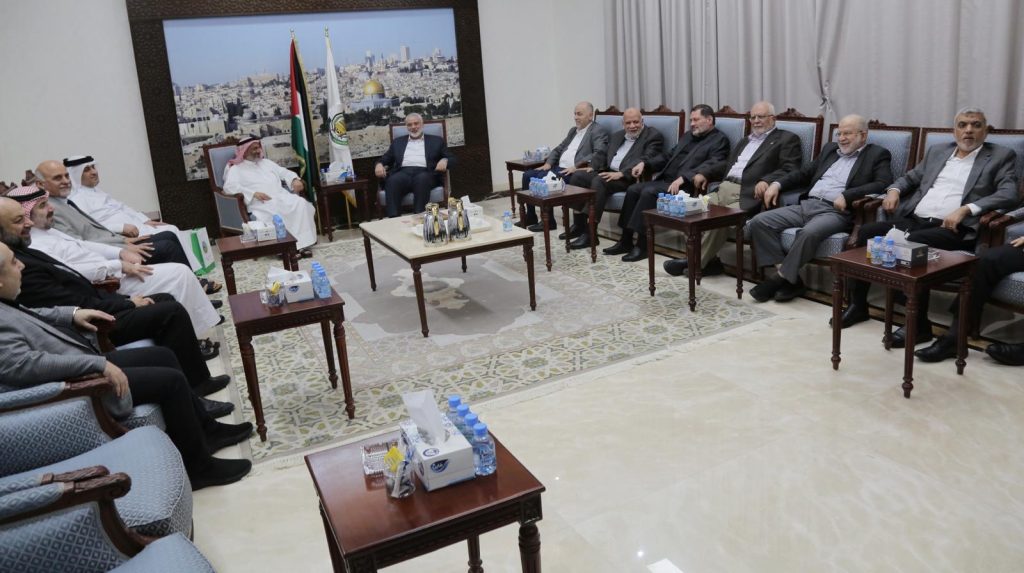 Haniyeh (to the right of the white flag) meets with al-Dhari (Hamas website, May 17, 2024)