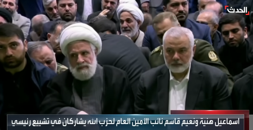 Na'im Qassem (turban) and Ismail Haniyeh (right) at the funeral (Al-Hadath, May 22, 2024).