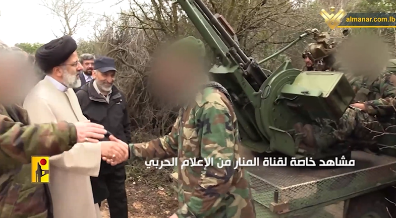 Raisi at a Hezbollah base in south Lebanon next to an anti-aircraft gun.