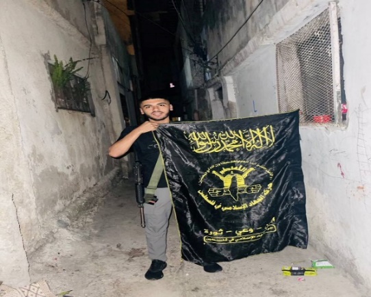 Luay Masha with a PIJ flag (@douneedmyname's X account, July 27, 2024)