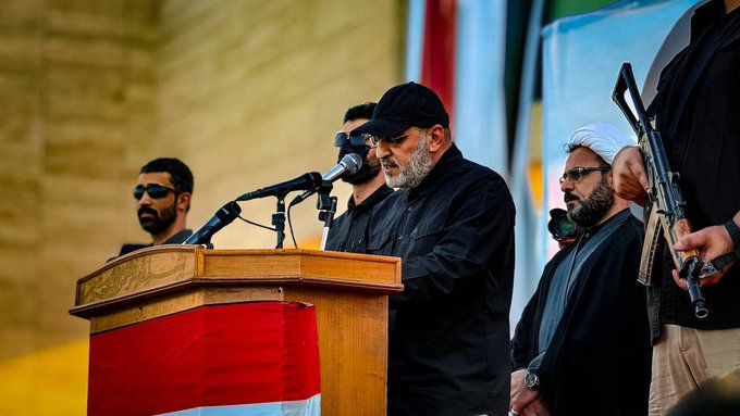 Al-Wala’i speaking at the rally (Almoqawm X account, October 11, 2024).