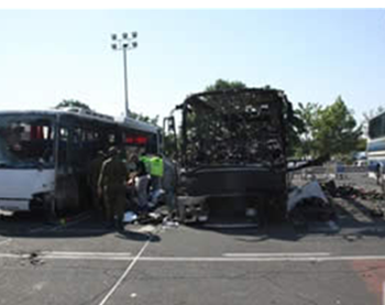 The burned-out bus at the airport in Burgas, Bulgaria (ZAKA spokesman, July 19, 2012).