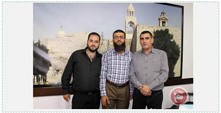 Nasser Laham (right), Ma'an's the editor-in-chief, and Muhammad Faraj (right) manager of the Ma'an satellite TV channel. They hosted senior PIJ operative Khader Adnan (center) in their offices in Bethlehem (Ma'an News Agency, September 1, 2015).