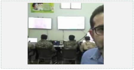 The Syrian-Iranian operations room set up in Aleppo before the Syrian army attack, waged with the support of Iranian fighters. The poster in the upper left hand corner shows Khamenei, Khomeini and an unidentified third person. The Persian text at the right reports on the operation room's activities (Fars News, October 22, 2015).