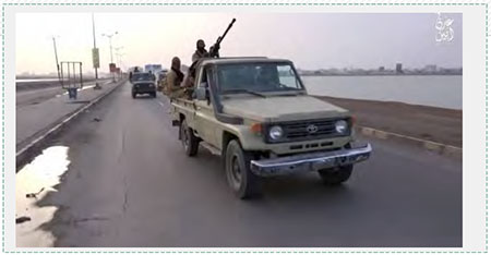 ISIS operatives drive along a coastal road in Yemen, apparently in the region of the port city of Aden (dailymotion.com, February 21. 2016) 